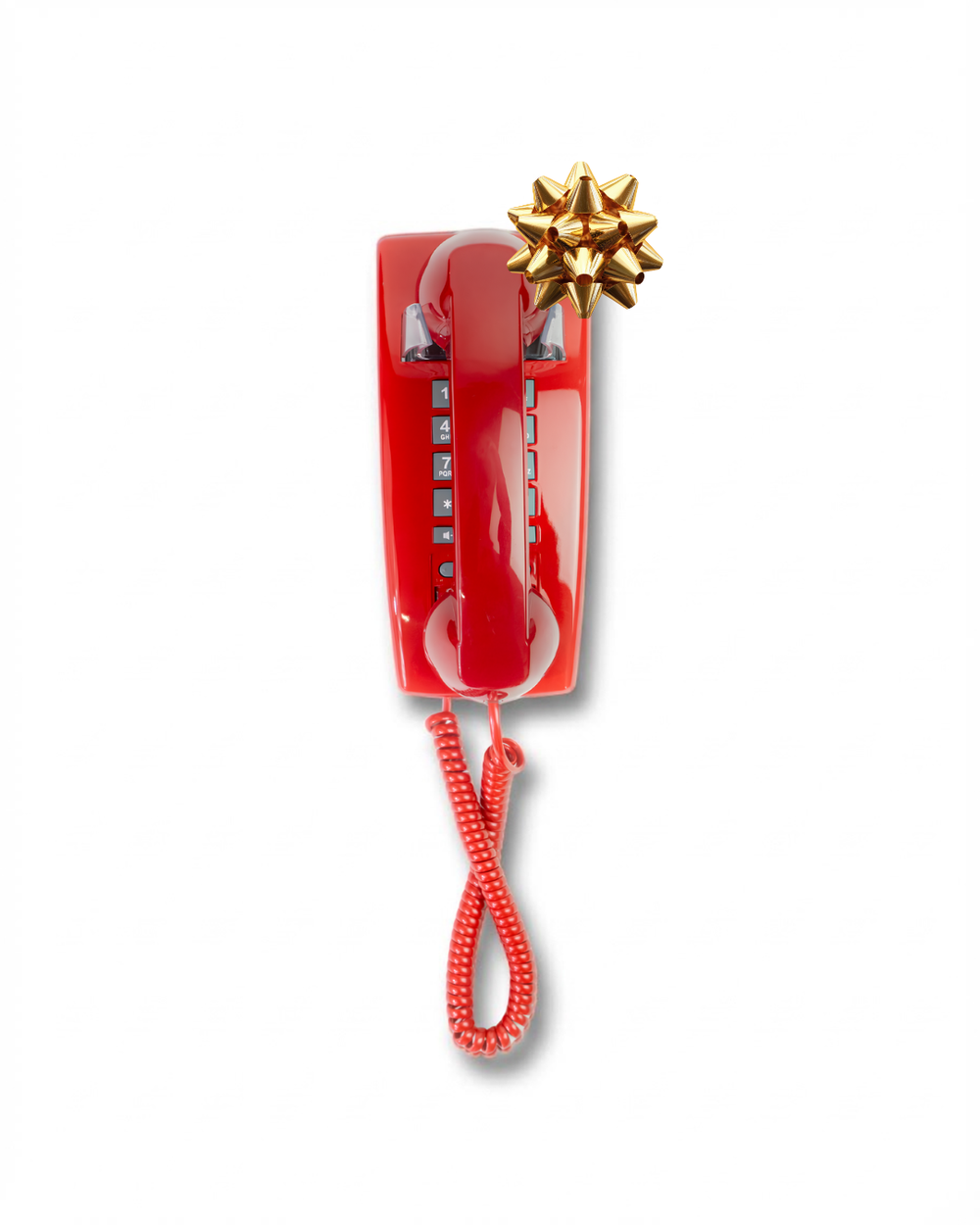 Red wall phone mounted on a white wall